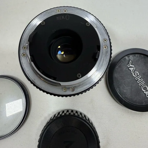 Yashica Zoom Lens 42- 75mm with case & Hakuba uv 55mm lens